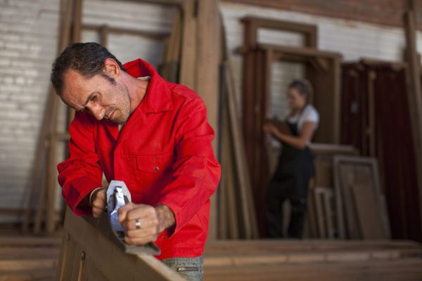 Carpenter using plane